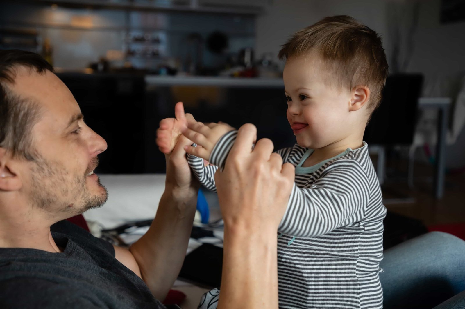 small-boy-with-down-syndrome-with-dad-2023-11-27-04-58-28-utc-min